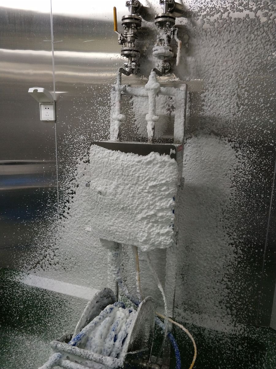 WONE satellite station spraying cleaning foam on equipment